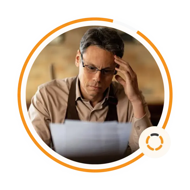 A restaurant owner reviewing paperwork